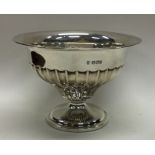 A heavy silver sugar bowl of half fluted design. S