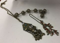 Three heavy Eastern silver necklaces. Approx. 264