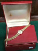 OMEGA: A small lady's gold wristwatch. Approx. 10
