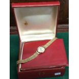 OMEGA: A small lady's gold wristwatch. Approx. 10