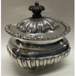 A fluted Victorian silver hinged caddy. London 1898. By Mappin and Webb. Approx. 196 grams. Est. £