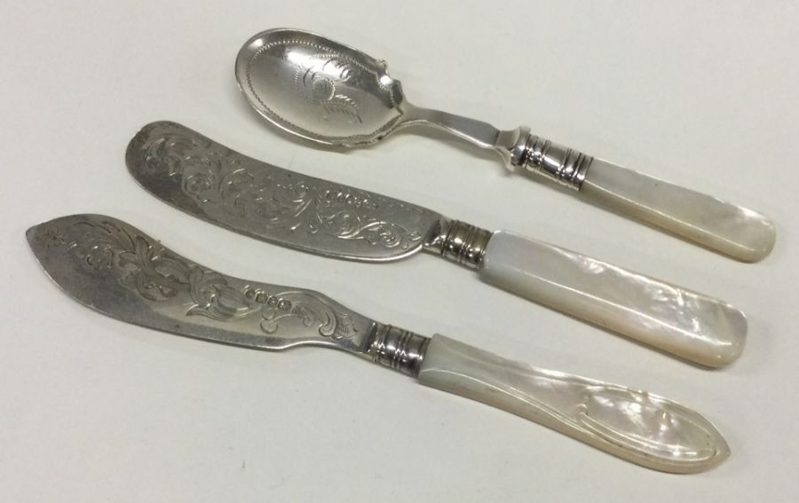 Two silver mounted MOP butter knives together with