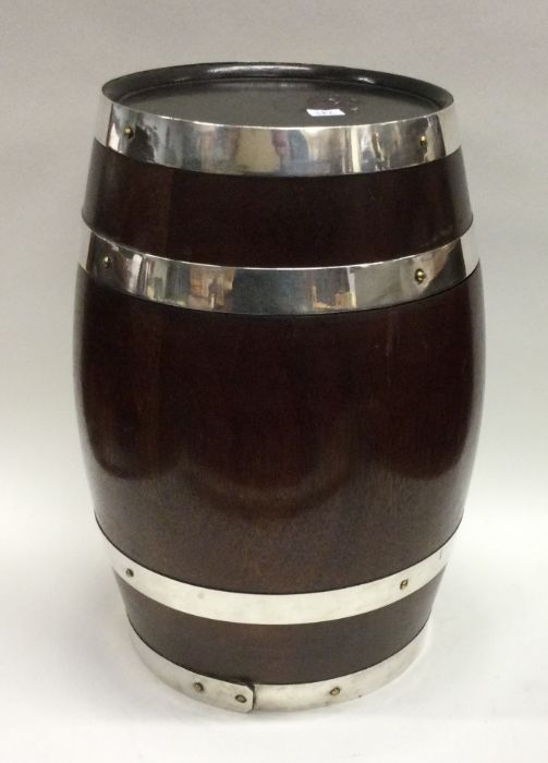 CARTIER: A fine novelty silver and wood champagne holder. Est. £800 - £1200.