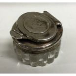 A Victorian silver and glass inkwell with screw top lid. Est. £100 - £150.