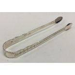 A pair of Georgian silver sugar tongs. London. By