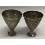 A pair of Continental silver cups of Eastern desig