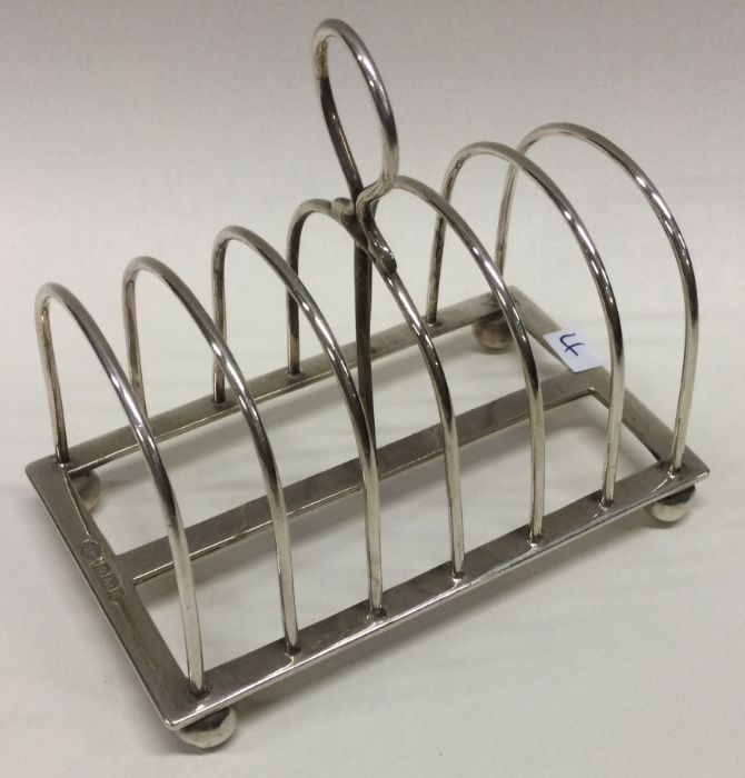 An Edwardian silver seven bar toast rack. Approx.