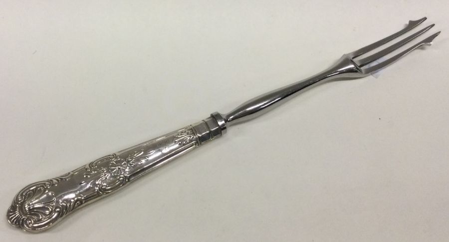 A Kings' pattern silver mounted pickle fork. Appro