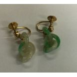 A pair of gold mounted jade drop earrings. Approx.