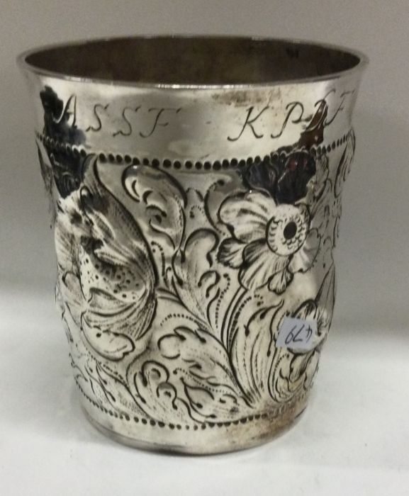 A large early 18th Century chased silver beaker. Maker’s mark only to base. Approx. 120 grams. - Image 2 of 3