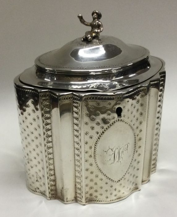 A Georgian silver hinged tea caddy with Chinoiserie finial. London 1789. By Robert Hennell.