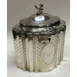 A Georgian silver hinged tea caddy with Chinoiserie finial. London 1789. By Robert Hennell.