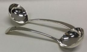 A heavy pair of Edwardian silver ladles. London. B