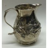 An early 18th Century Georgian silver jug. London 1728. Approx. 64 grams. Est. £120 - £150.