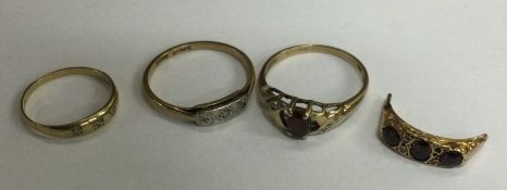 A group of three 9 carat stone set rings. Approx.