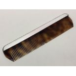 A silver and enamelled hair comb. London 1963. Approx. 54 grams. Est. £60 - £80.