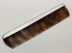 A silver and enamelled hair comb. London 1963. Approx. 54 grams. Est. £60 - £80.