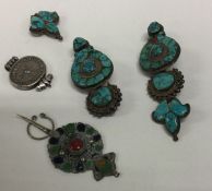 A box containing turquoise and silver mounted jewe