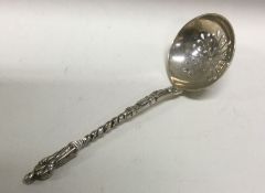 An Apostle design silver sifter spoon. Sheffield 1921. By Harrison Brothers. Approx. 29 grams.
