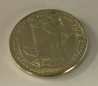 A silver Britannia coin. Approx. 31 grams. Est. £30 - £50.
