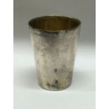 An early 18th/19th Century Continental silver beaker. Approx. 17 grams. Est. £60 – £80.