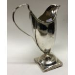 A George III silver cream jug with swag decoration. London 1803. Approx. 103 grams. Est. £80 - £