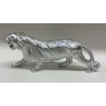 A heavy silver plated figure of a tiger. Est. £30 - £50.