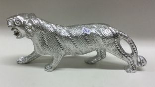A heavy silver plated figure of a tiger. Est. £30 - £50.