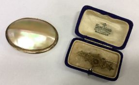An MOP and gold plated brooch together with one ot