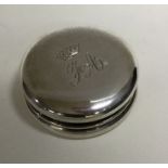 A heavy chased silver hinged top box decorated with flowers. Approx.28 grams. Est. £20 -£30.