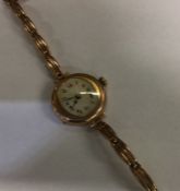 A lady's 9 carat wristwatch on strap. Approx. 20 g