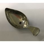 A George III heart shaped silver handled caddy spoon with bright cut bowl. Birmingham 1809. By