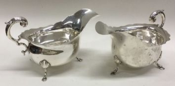 A pair of Edwardian silver sauce boats with scroll
