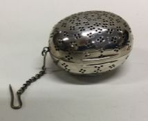 A Victorian silver tea infuser with suspension chain. London 1875. By George Heath. Approx.44 grams.