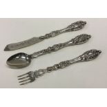 A silver three piece christening set. Approx. 89 g