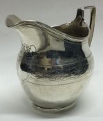 A George III 18th Century silver jug. London 1786. Approx. 90 grams. Est. £100 - £150.