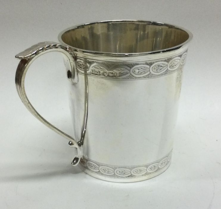 A fine engraved silver christening mug. Sheffield 1928. By James Dixon and Sons. Approx. 136