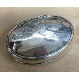 An 18th Century hinged silver snuff box. Maker’s mark only, ‘GM’. Circa 1730. Approx. 38 grams. Est.