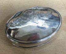 An 18th Century hinged silver snuff box. Maker’s mark only, ‘GM’. Circa 1730. Approx. 38 grams. Est.