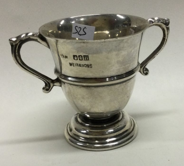 DUBLIN: An Irish silver two handled cup. 1949. By Weir and Sons. Approx. 59 grams. Est. £50 - £80.