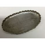 A Continental silver tray embossed with a castle. Approx.59 grams. Est. £50 - £80.