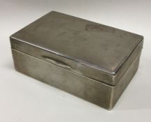 A heavy silver lidded engine turned cigar box. London 1926. Approx. 429 grams. Est. £150 - £200.