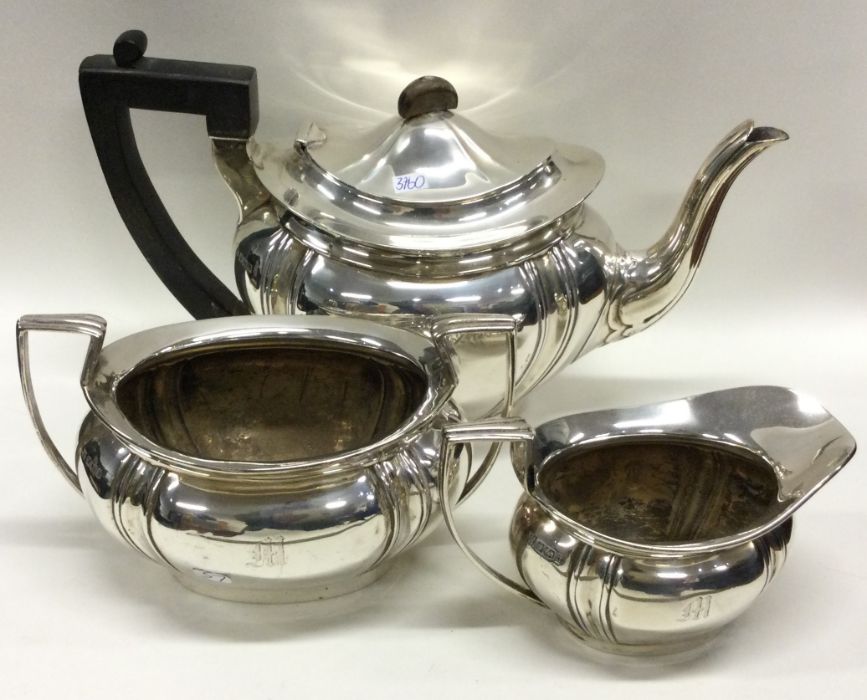 A heavy silver three piece tea set. Sheffield. App