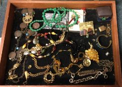 A cabinet containing costume jewellery. Est. £30 -