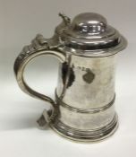 An 18th Century silver lidded tankard. London 1754. By William Shaw and William Priest. Approx.