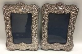 A pair of embossed silver picture frames. London m