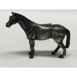 A novelty English silver figure of a horse. Fully marked to base. Approx.34 grams. Est. £80 - £120.