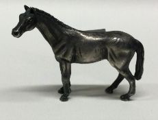 A novelty English silver figure of a horse. Fully marked to base. Approx.34 grams. Est. £80 - £120.