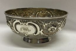 A Victorian chased silver bowl embossed with flowers. London 1860. By Edward Kerr Reid. Approx.