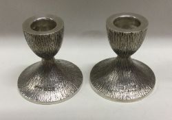 A pair of silver candlesticks with bark finish. Birmingham 1973. By Deakin & Francis. Special mark